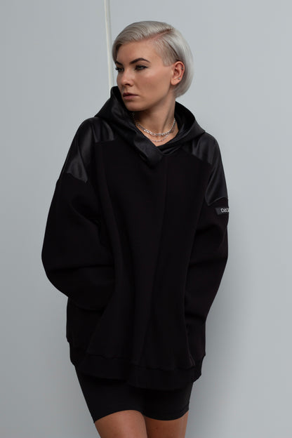 H01 | Oversized black hoodie with black faux leather inserts